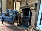 Chair by log burner Chair by log burner